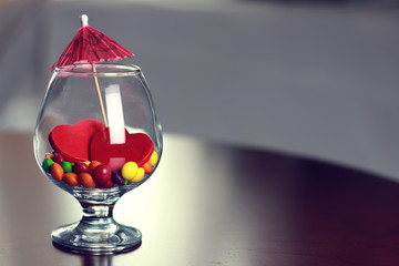 glass with candy pill