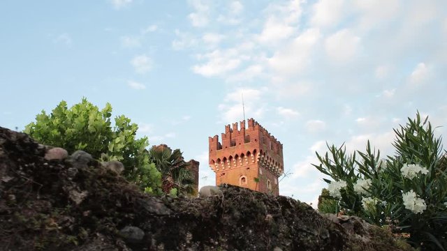 Shot of old castle tower in Lazise, City at Garda Lake in Italy.
Filmed on a Glidecam in 4k at 60 fps so it can be slowed down if desired.