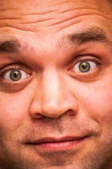 Surprised, shocked, astonished man. Facial expression, emoji face, emotion close-up.