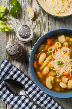 Minestrone soup with pasta and cheese.