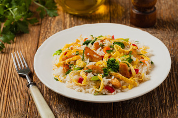 Nasi goreng. Fried rice with egg and vegetables.
