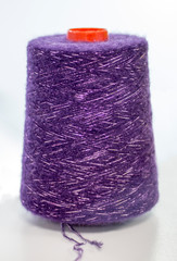 purple yarn with lurex on white background
