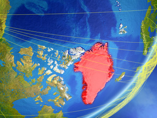 Greenland on model of planet Earth with network at night. Concept of new technology, communication and travel.