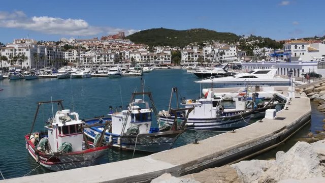Static Wide Shot - Traditional Spanish Fishing Boats at Puerto de La Duquesa in Spain