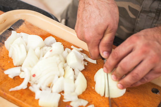 White onion chopping. Cook hands