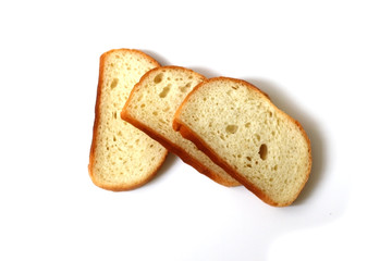Sliced loaf of white bread lies on a white background