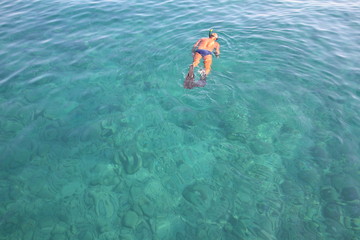 man snorkeling in the sea