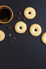 Coffee in cup and tasty shortbread cookies