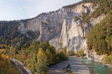 View of cliffs from sunny autumnal Ruinaulta - Rheinschlucht (Rhine canyon) near Versam-Safien, Switzerland