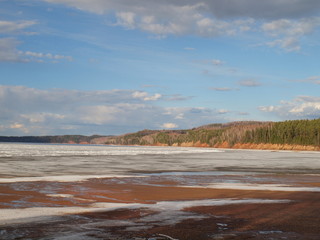Spring river, the ice is melting. Russian spring nature. Russia, Ural, Perm Region