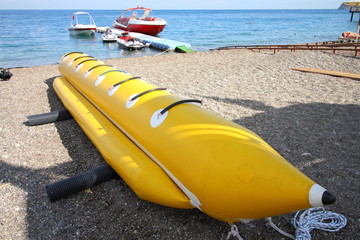 inflatable yellow banana on the beach