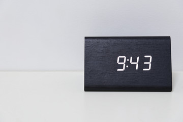 Black digital clock on a white background showing time 9:43