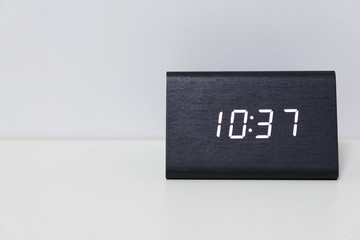 Black digital clock on a white background showing time 10:37
