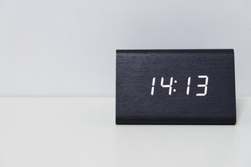 Black digital clock on a white background showing time 14:13