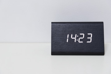 Black digital clock on a white background showing time 14:23