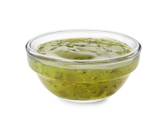 Tasty green sauce in bowl on white background