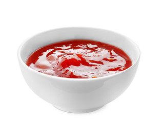 Tasty tomato sauce in bowl on white background