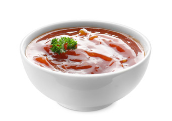 Tasty tomato sauce in bowl on white background