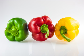 colorful bell peppers isolated on white background