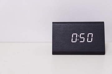 Black digital clock on a white background showing time 0:50