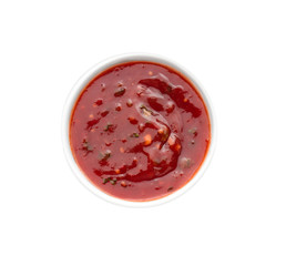 Tasty tomato sauce in bowl on white background