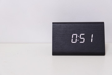 Black digital clock on a white background showing time 0:51