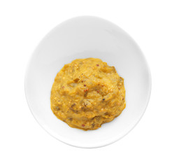 Plate with tasty sauce on white background