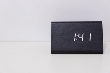 Black digital clock on a white background showing time 1:41