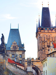 Charles Bridge in Prague, Czech Republic. Downtown, skyline on sunset, Lesser Town Bridge Towers, sculptures of Charles Bridge