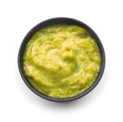 Tasty green sauce in bowl on white background