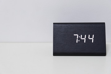 Black digital clock on a white background showing time 7:44