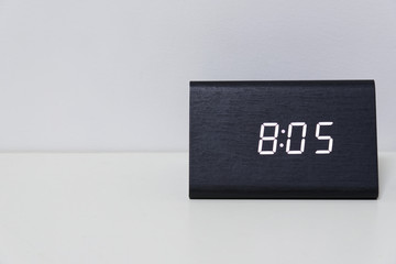 Black digital clock on a white background showing time 8:05