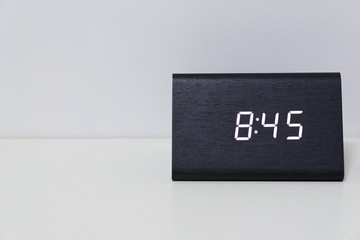 Black digital clock on a white background showing time 8:45