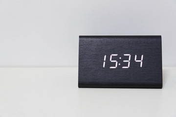 Black digital clock on a white background showing time 15:34