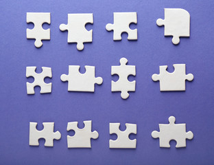 Pieces of jigsaw puzzle on color background