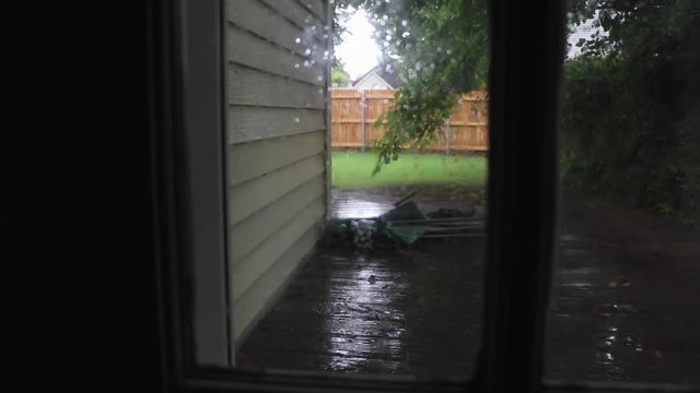 Shot of door with rain outside.