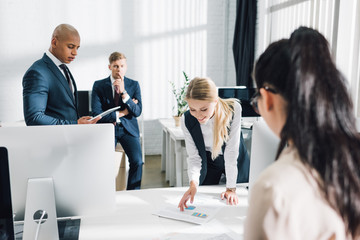 Fototapeta premium focused young multiethnic business people working together in open space office