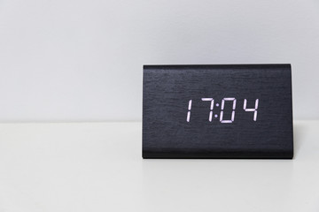 Black digital clock on a white background showing time 17:04