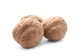 Tasty walnuts on white background