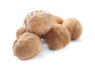 Tasty walnuts on white background