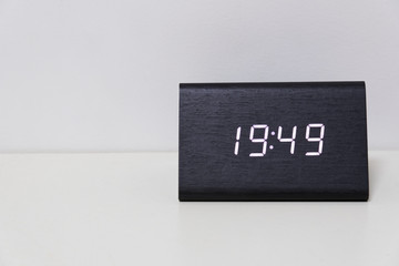 digital table clock showing 19:49 time