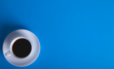 cup of coffee on blue background