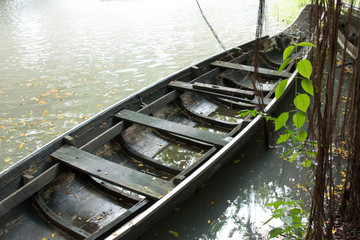 Close up of wooden boat floating on the water.
