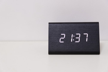 digital table clock showing 21:37 time