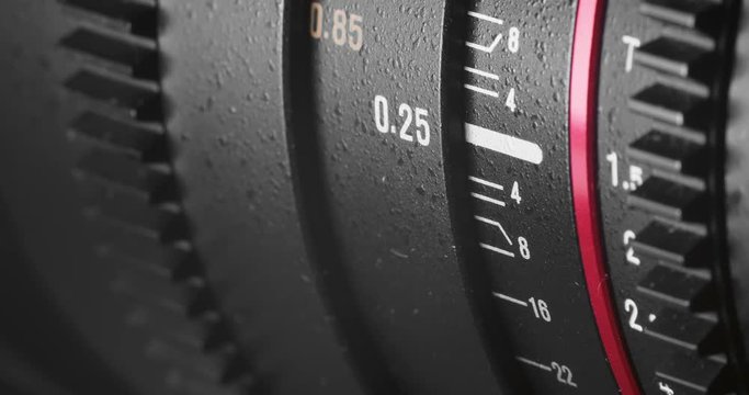 Rotating focus ring on modern cinema camera lens. Focus pull. Close up shot.