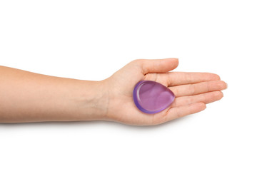 Woman holding silicone sponge on white background