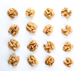 Shelled walnuts on white background