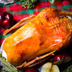festive stuffed roast goose with red cabbage and dumplings
