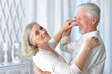 Portrait of happy smiling senior couple dancing