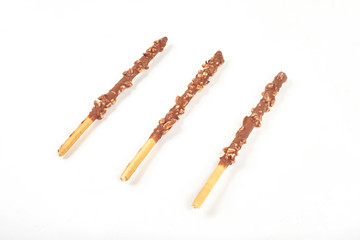 Biscuit stick with chocolate and almond on white background.